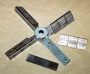 The photograph shows a New Laempe sand mixer blade protected by Wear-Tect-It.